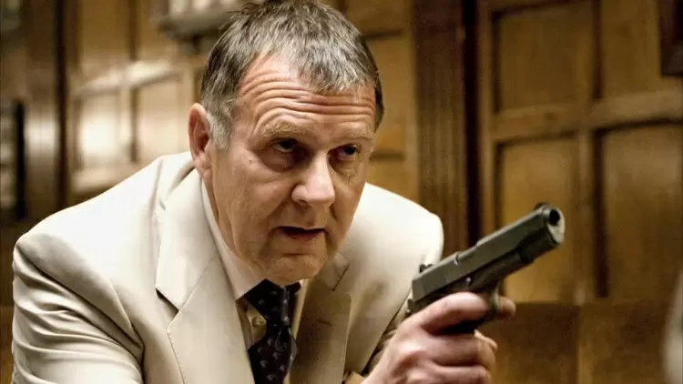 Name the Gotham City Crime Boss Bruce confronts before he leaves to begin his training.