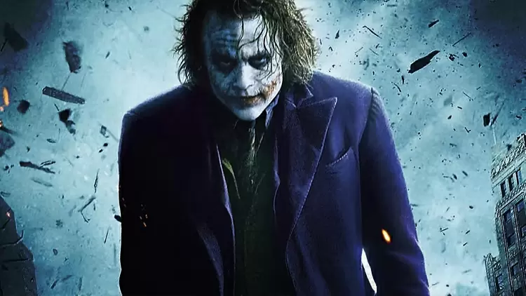 In The Dark Knight, who is the first public figure murdered by The Joker?