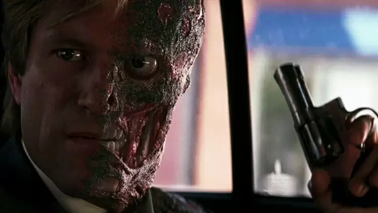 When Harvey Dent becomes Two-Face, he begins targetting people he holds responsible for what tragedy?