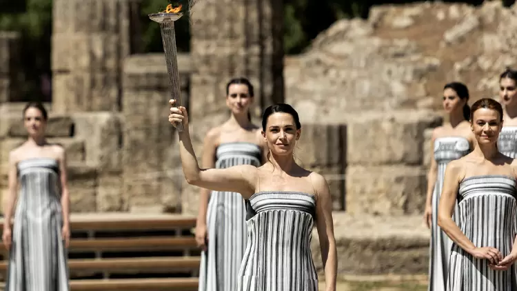 How is the Olympic flame usually lit?