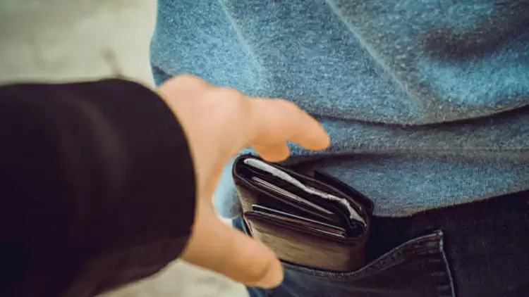 On a bus, if you see someone's wallet being stolen, what would you do?