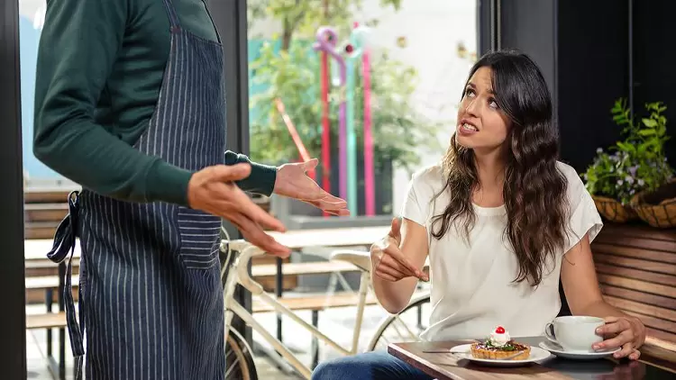 If you order food in a restaurant and the waiter has a bad attitude, you will: